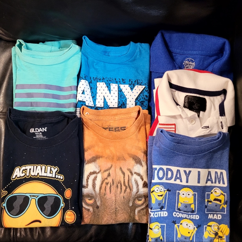 7 T shirts for boys size medium in excellent like new condition.